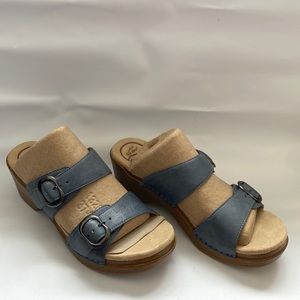 Dansko sandal double strap single stitch leather sturdy heel resembles a wedge.